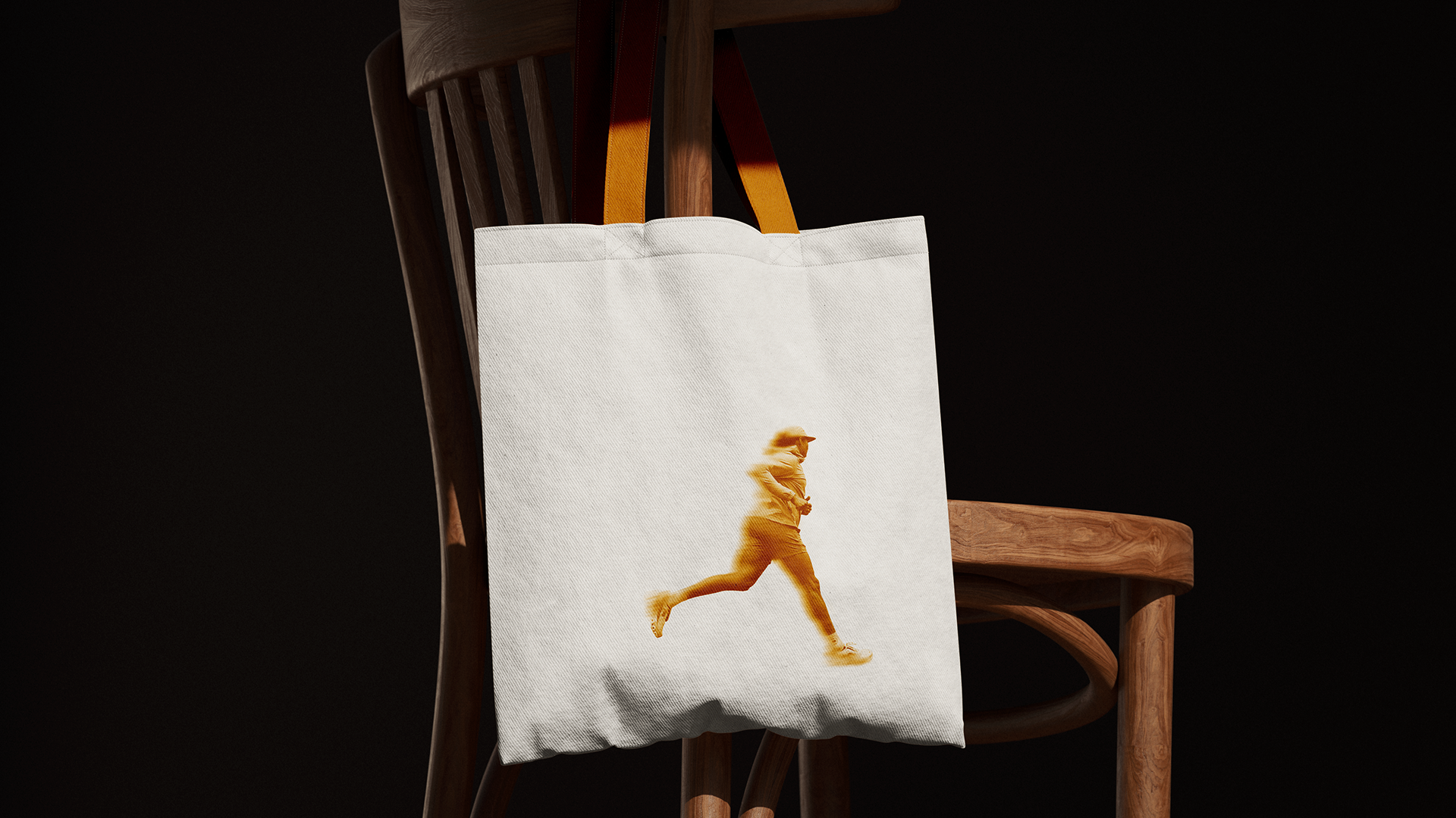 2nd Wind tote bag with runner silhouette, on a chair